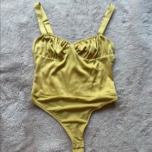 Danielle brestein gold body suit , worn once